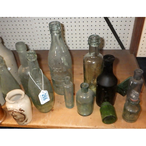 266 - A large qty of advertising glass bottles and stoneware etc