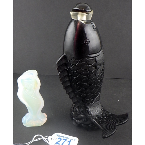 271 - A red glass bottle in the shape of a fish together with an opalescent glass Buddha (2)