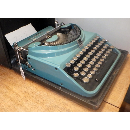 301 - An Olivetti MP1 ICO typewriter, marine blue paint, cased.