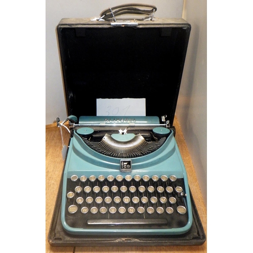 301 - An Olivetti MP1 ICO typewriter, marine blue paint, cased.