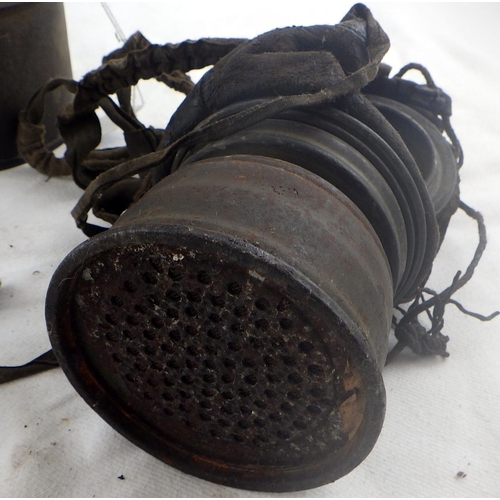 302 - Military interest: a German WW1 gas mask in original canister with soldier's name painted to lid.
