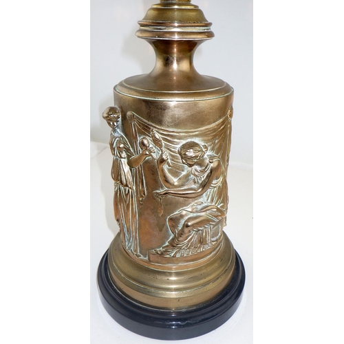 133 - A figural brass based oil lamp