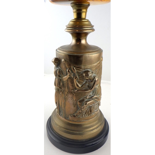 133 - A figural brass based oil lamp