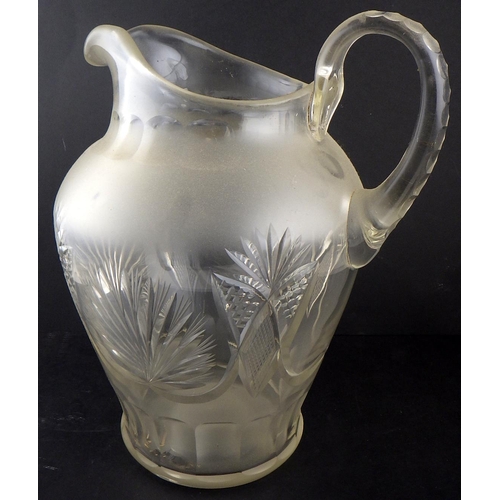 163 - An oversize water jug having cut decoration.