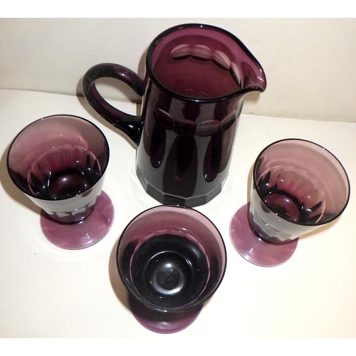 165 - Three William Yeoward amethyst coloured cut glass bucket rummers together with a matching water jug;... 