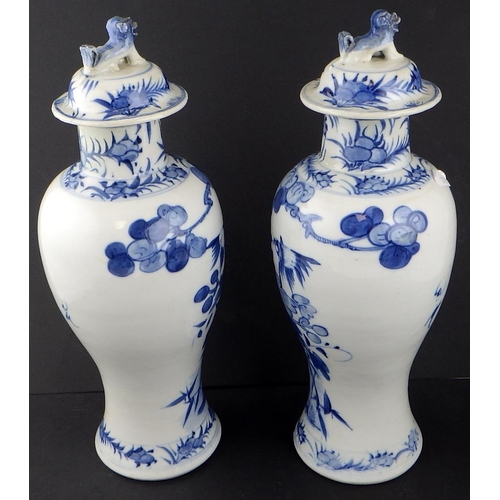171 - A pair of Chinese blue and white baluster vases with covers; two Delft vases.  A/F  (4)