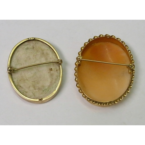 55 - A shell carved cameo brooch in a 9ct gold mount, 49 x 38mm; a bisque cameo brooch in a yellow metal ... 