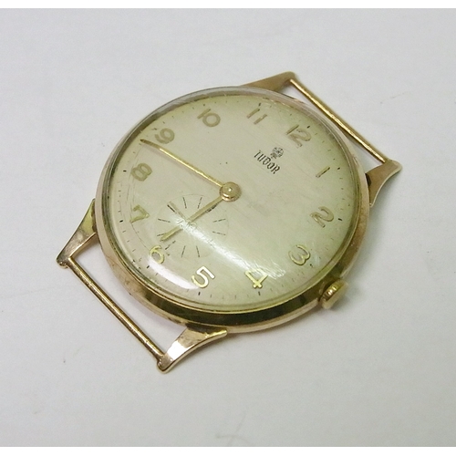 78 - A Tudor wristwatch head comprising a 17 jewel Tudor manual wind movement in a 9ct gold fixed lug cas... 