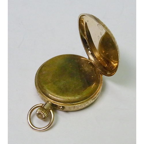 84 - A pocket watch comprising a pin-set movement in a yellow metal front and back case marked 14kt.  33m... 