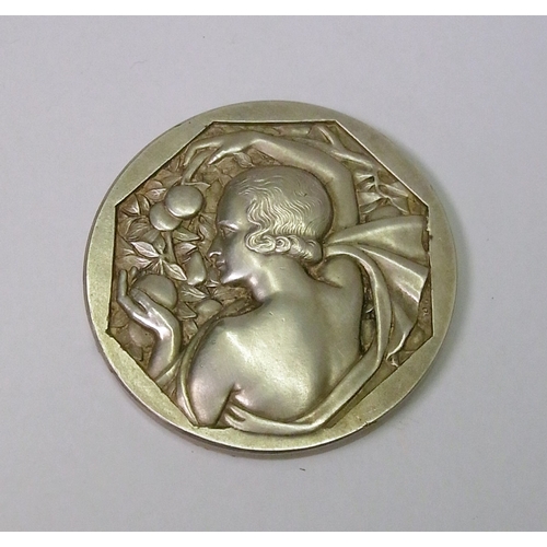 101 - An Art Deco prize medal by R Cochet / J. D'Estray, silvered bronze, 50mm diameter. Cased.