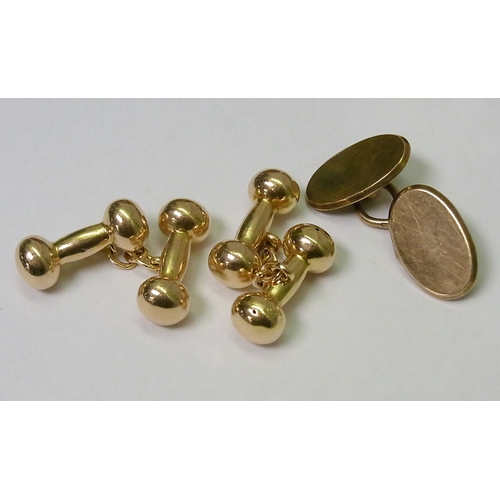114 - A pair of chain link dumb bell shaped cufflinks, 15ct gold, heads 19mm long, 5.5g; other cufflinks a... 