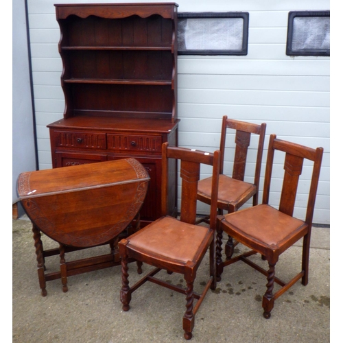 700 - A small barleytwist oak gateleg table, 3 chairs and a linenfold dresser (5)