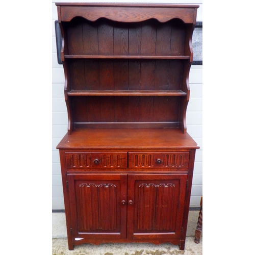 700 - A small barleytwist oak gateleg table, 3 chairs and a linenfold dresser (5)