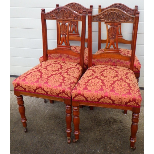 705 - An Edwardian oak wind out dining table with one leaf on reeded legs, together with a set of four Edw... 