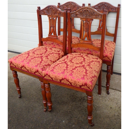 705 - An Edwardian oak wind out dining table with one leaf on reeded legs, together with a set of four Edw... 