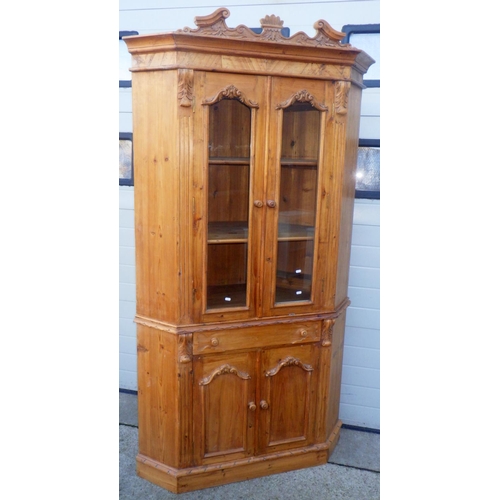 706 - A reproduction tall pine corner cabinet, in one piece, 220cm tall