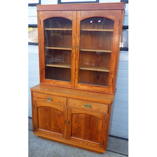 709 - A pitch pine chiffonier bookcase, on a later base, 116cm wide,