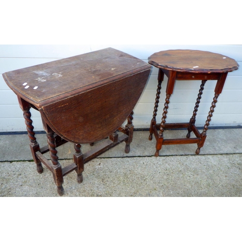 711 - A 1930's barleytwist oak gateleg table together with an oval occasional table, a/f (2)