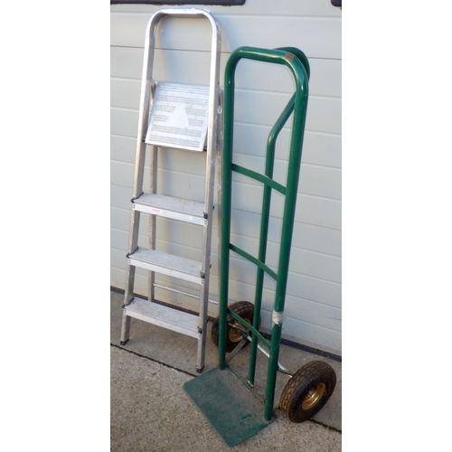 717 - A green sack barrow, tyres deflated, together with a set of aluminium step ladders (2)