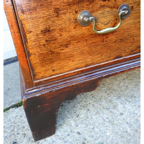 719 - A 19th cen oak and mahogany banded chest of drawers, with later feet and handles, 82cm wide