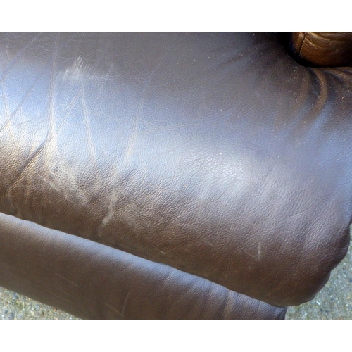 729 - A brown leather electric recliner chair, some wear