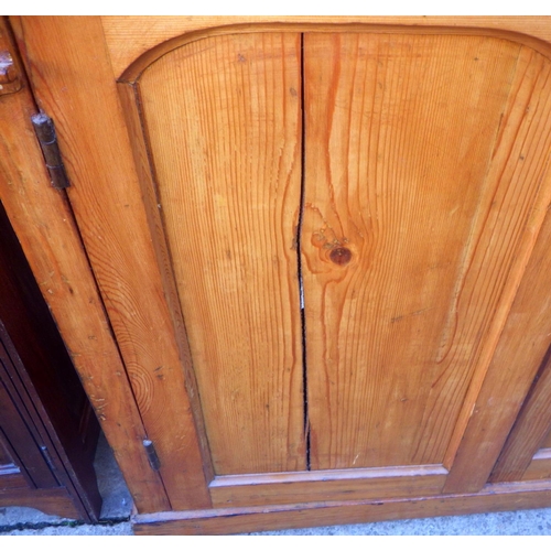 734 - A Victorian pine chiffonier base, doors split, 102cm wide a/f, together with a bedside cabinet (2)