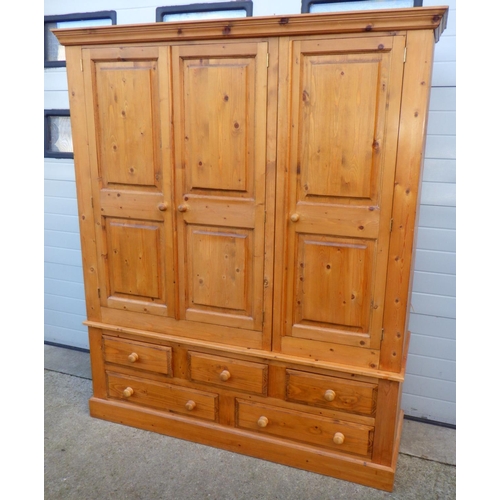 740 - A modern pine wardrobe, 204cm tall, 174cm wide