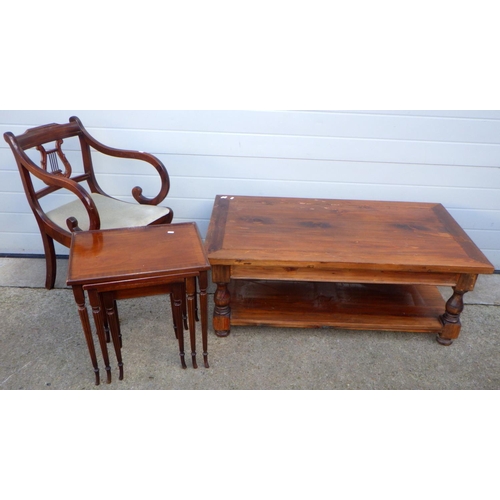 743 - A coffee table, marked, 123cm long together with a nest of occasional tables and a carver chair fram... 