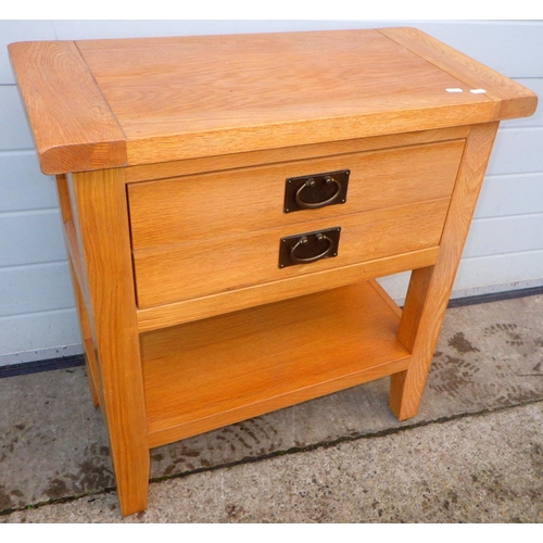 750 - A modern oak side table with single drawer together with two wicker chairs (3)