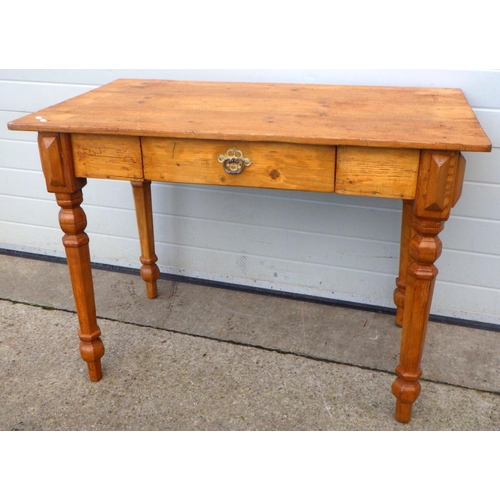 759 - A stripped pine side table, 115cm wide