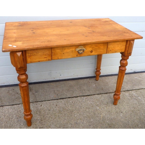 759 - A stripped pine side table, 115cm wide