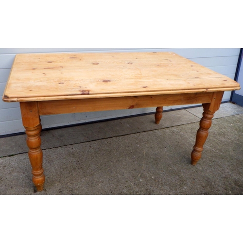 760 - A pine kitchen table, 153cm long, 102cm across