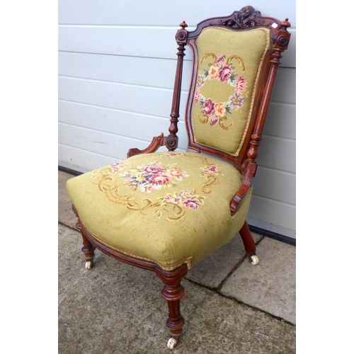 761 - A late Victorian walnut nursing chair