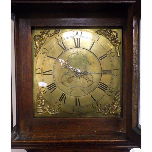 762 - A 30 hour oak longcase clock with brass face, signed John Steel, missing feather, 204cm tall