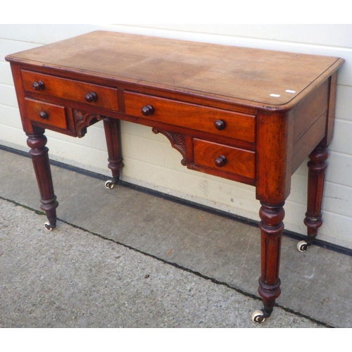 764 - A Victorian mahogany dressing table on turned legs, 106cm wide