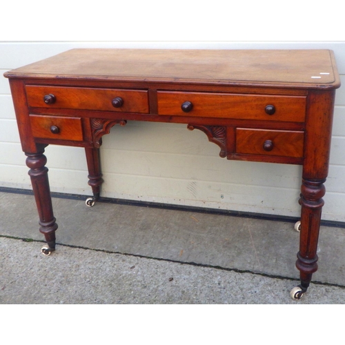 764 - A Victorian mahogany dressing table on turned legs, 106cm wide