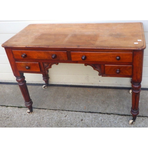 764 - A Victorian mahogany dressing table on turned legs, 106cm wide