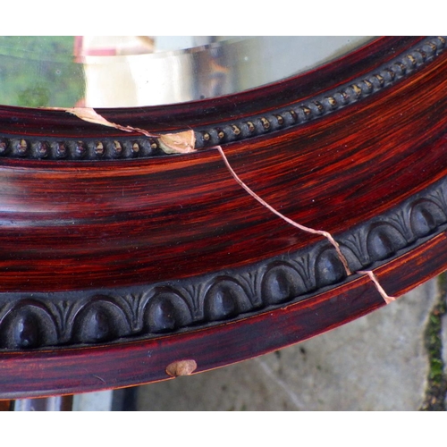 765 - A mahogany China cabinet together with an oval mirror, frame cracked (2)