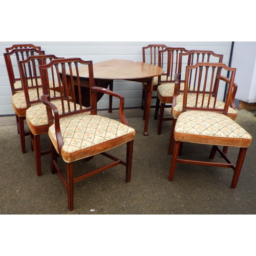 769 - A Geo III mahogany, pad foot, drop leaf dining table together with a set of eight dining chairs with... 