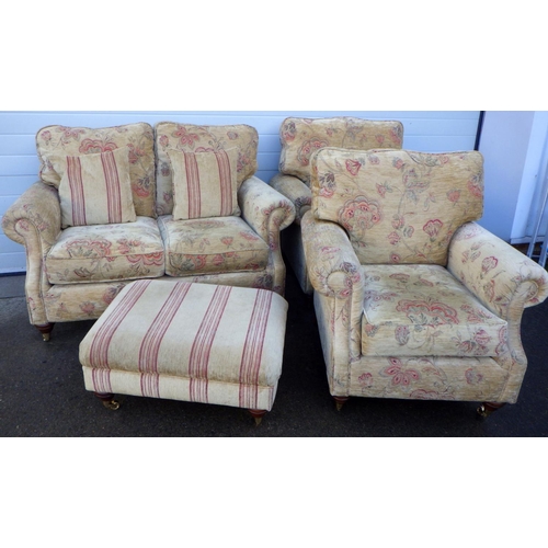 776 - A three piece suite with footstool (4)