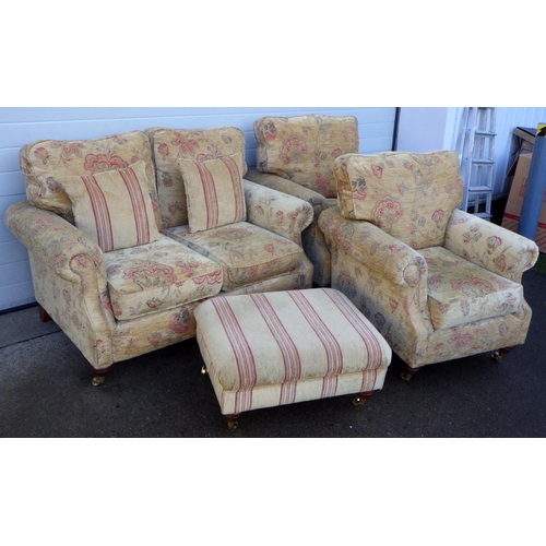 776 - A three piece suite with footstool (4)