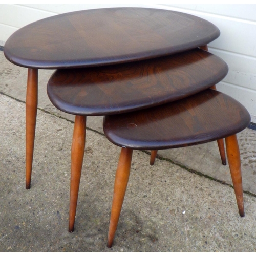 784 - A pebble nest of three dark Ercol occasional tables