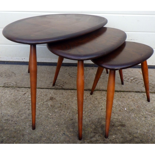 784 - A pebble nest of three dark Ercol occasional tables