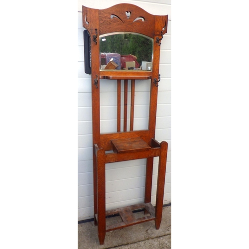 787 - A 1930's oak hallstand, missing tins, 68cm wide