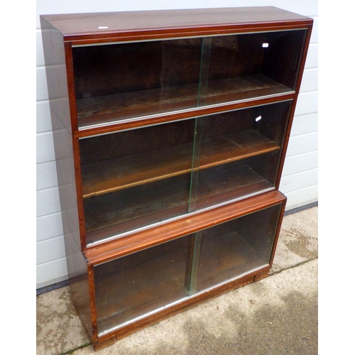 807 - A three section bookcase with sliding glass doors, 90cm wide