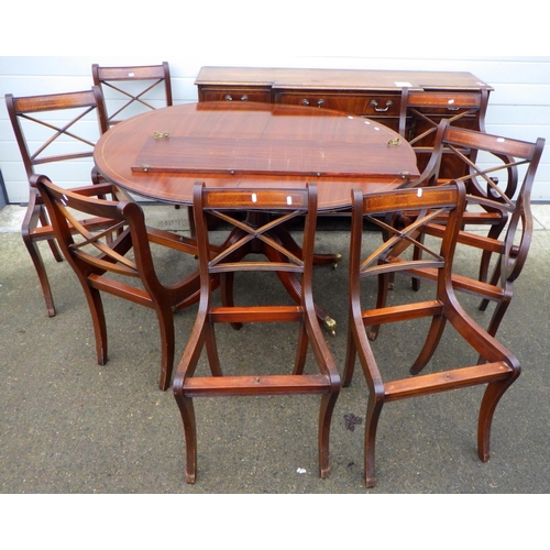 810 - A reproduction mahogany single pedestal dining table with sideboard, marked and seven chair frames (... 