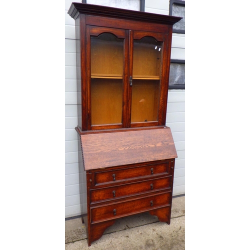 814 - A 1930's oak bureau bookcase, 100cm wide