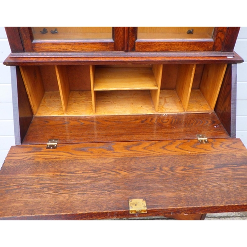 814 - A 1930's oak bureau bookcase, 100cm wide