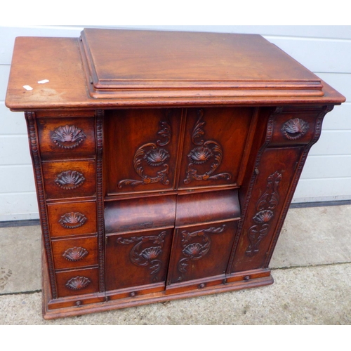 816 - A Singer sewing machine in a walnut parlour cabinet, dent to top