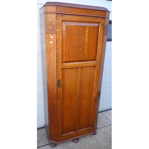 825 - A 1930's oak hall wardrobe, 77cm wide